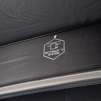SkyTrack II System logo on black outdoor gear fabric with zipper detail