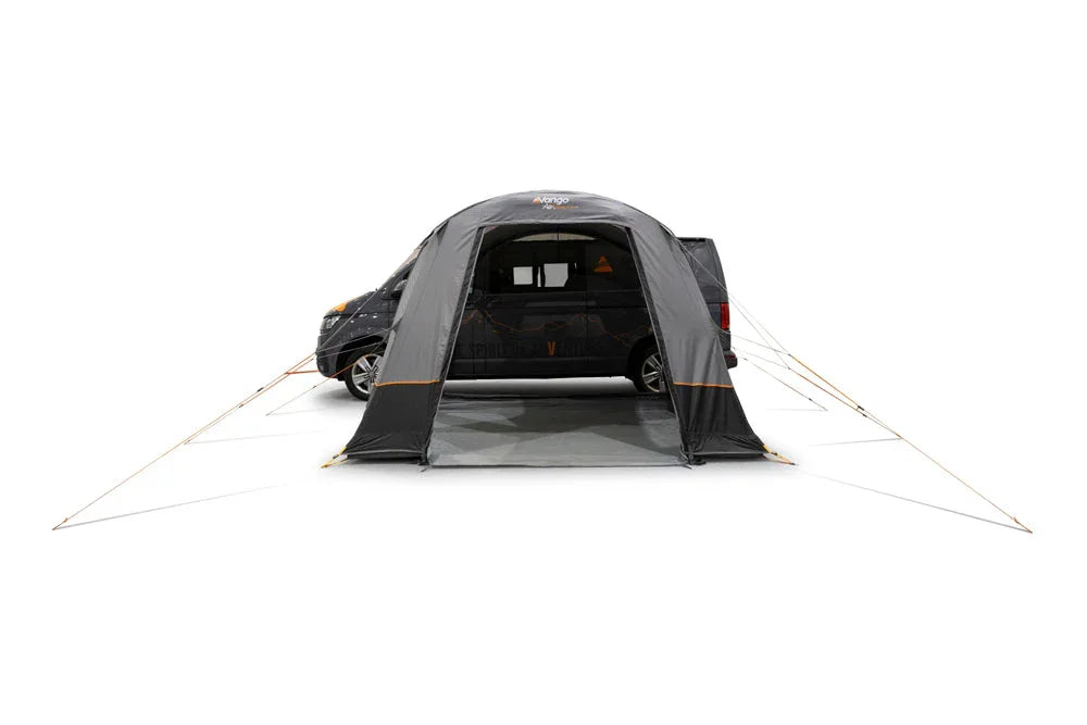 Black motorhome awning attached to van, ideal for camping and outdoor adventures
