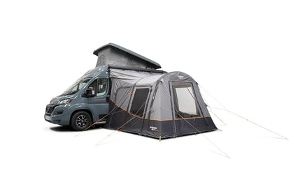 Motorhome awning attached to campervan, featuring pop-up roof and side windows for outdoor camping comfort.
