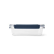 Clear plastic food container with navy blue lid for camping and outdoor meals