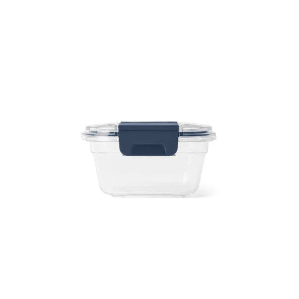 Clear plastic food container with navy blue lid for camping and outdoor cooking
