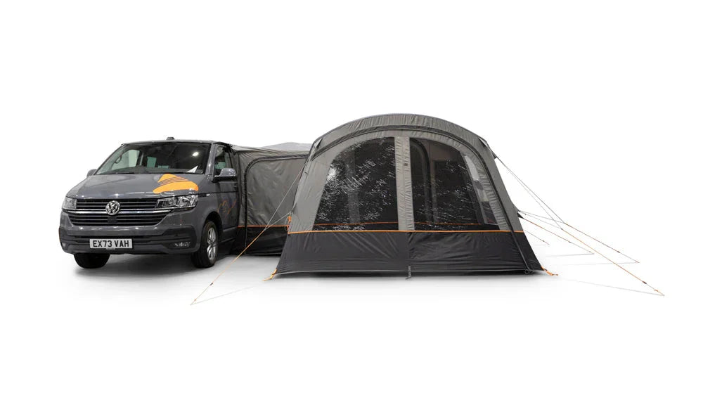 Van with a large camping tent attached on a white background
