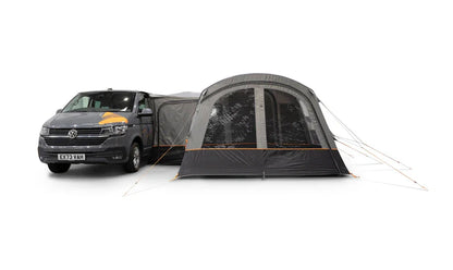 Van with a large camping tent attached on a white background