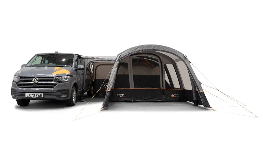 Van with a caravan awning extended on a white background