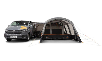 Van with a caravan awning extended on a white background
