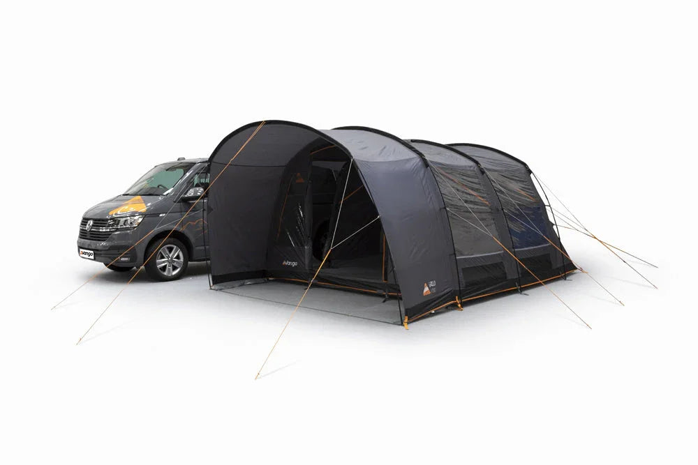 Black motorhome awning attached to van, ideal for camping and outdoor adventures with spacious shelter.