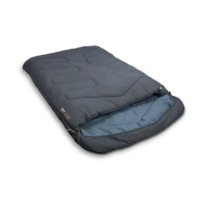 Dark gray camping sleeping bag with quilted design and blue interior lining
