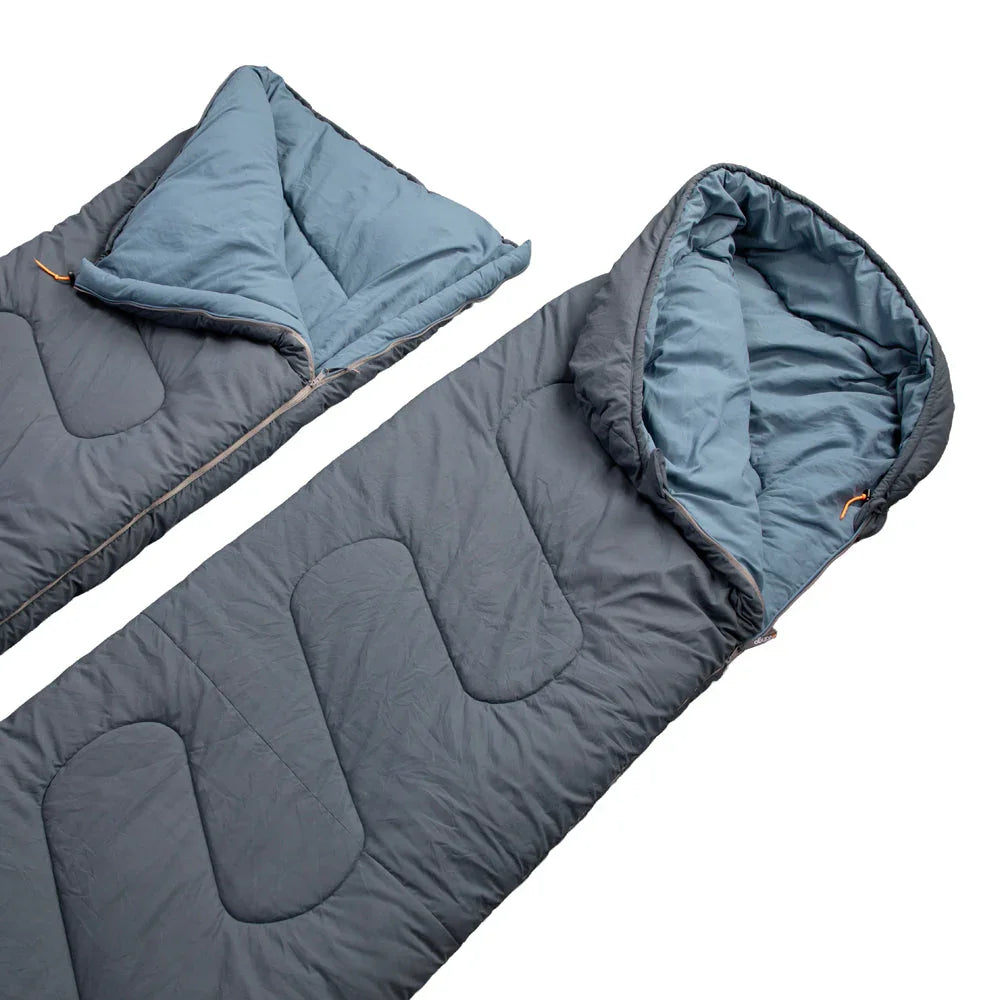 Grey and blue camping sleeping bag with quilted design, ideal for outdoor adventures and camping trips.