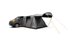 Motorhome awning attached to van, ideal for camping and outdoor adventures with spacious shelter.