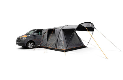 Motorhome awning attached to van, ideal for camping and outdoor adventures with spacious shelter.