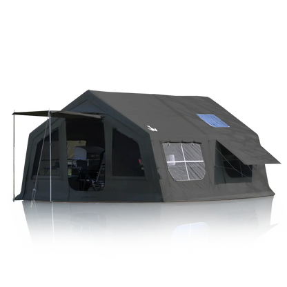 Large black camping tent with awning, windows, and interior furniture for outdoor adventures