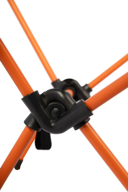Orange camping tent poles with black connectors for outdoor adventures