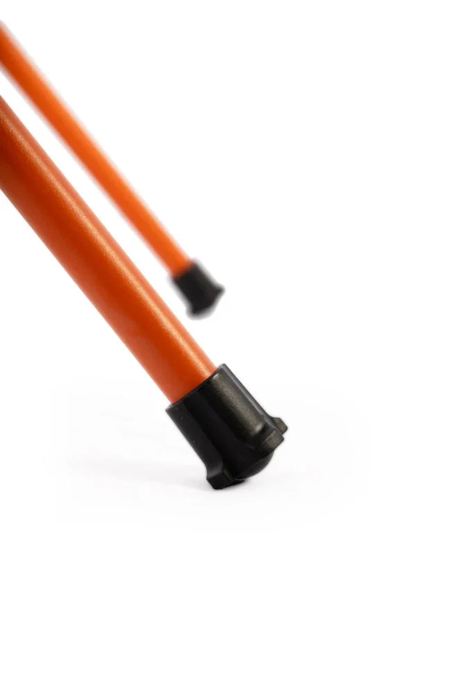 Orange camping tent poles with black plastic tips for outdoor adventures