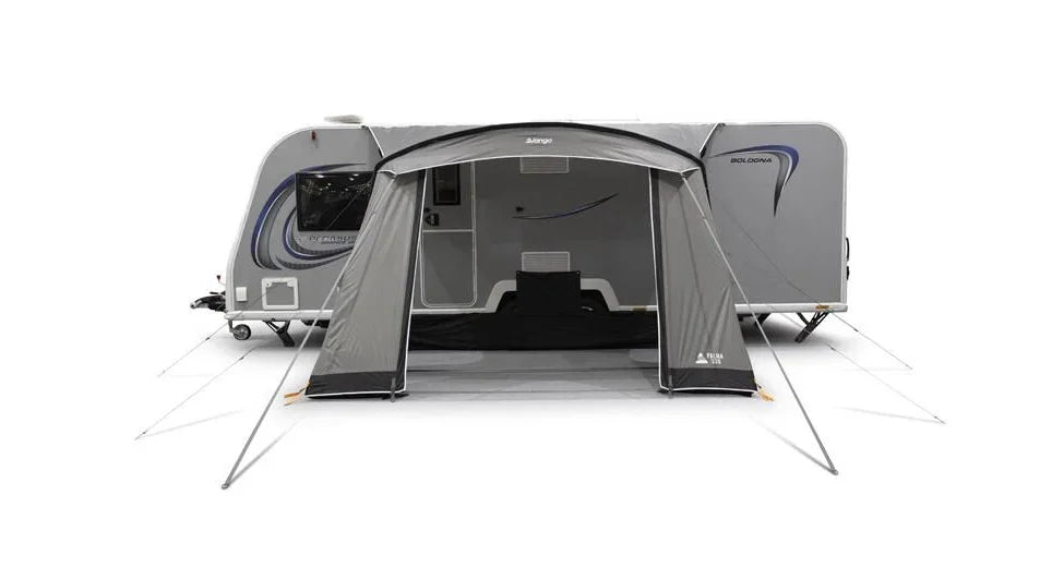 Grey caravan awning attached to a Bologna caravan, ideal for camping and outdoor adventures.