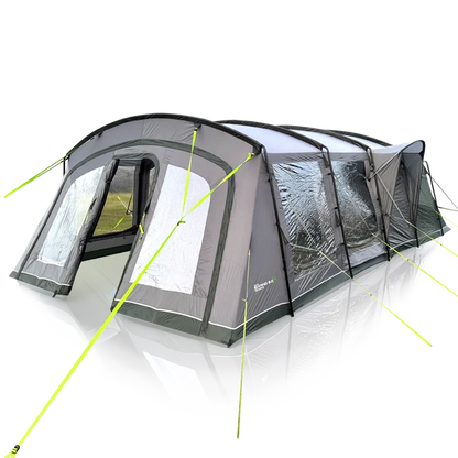 Large family camping tent with awning, mesh windows, and bright green guy lines for outdoor adventures.