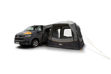 Black and gray motorhome awning attached to van, featuring orange accents and mesh windows for camping adventures.