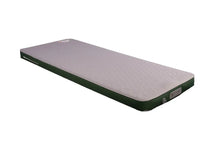 Inflatable camping mattress with green sides and textured surface for outdoor sleeping comfort