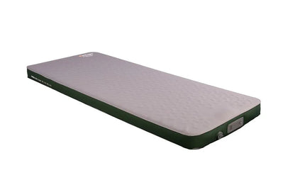 Inflatable camping mattress with green sides and textured surface for outdoor sleeping comfort