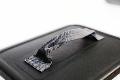 Black suitcase with a handle on a white background