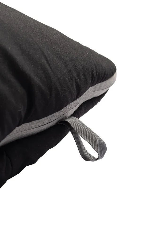 Black camping pillow with gray trim and carry strap for outdoor adventures