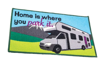 Embroidered patch with an RV and 'Home is where you park it.' text on a green background