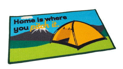 Doormat with a tent design and text 'Home is where you pitch it.' on a blue and green background.