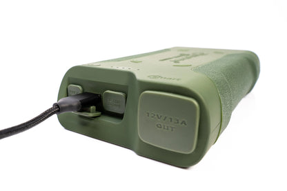 Olive green portable power bank with USB-C, USB-A, and 12V output for camping and outdoor adventures